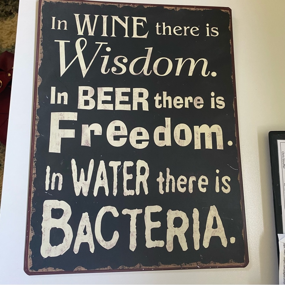 In wine there is Wisdom metal sign. 10.5”W x 14”H. Weathered/rustic look